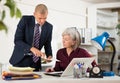 Man and woman clerical workers in office