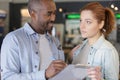 man and woman with clipboard