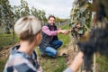 Man and woman collecting grapes in vineyard in autumn, harvest concept. Royalty Free Stock Photo