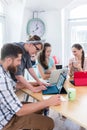 Man and woman cooperating as co-workers in collaborative office