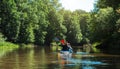 Man and woman couple in family kayak trip rowing boat on the river, a water hike, a summer adventure. Eco-friendly and extreme Royalty Free Stock Photo