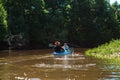 Man and woman couple in family kayak trip rowing boat on the river, a water hike, a summer adventure. Eco-friendly and extreme Royalty Free Stock Photo