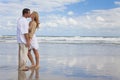 Man & Woman Couple Holding Hands Kissing On Beach