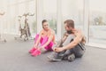 Man and woman, couple lace shoes at gym after training Royalty Free Stock Photo