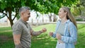 Man and woman couple smiling confident dancing at park Royalty Free Stock Photo