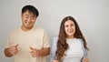 Man and woman couple smiling confident dancing together over isolated white background Royalty Free Stock Photo