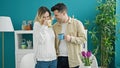 Man and woman couple smiling confident drinking coffee at dinning room Royalty Free Stock Photo