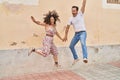 Man and woman couple smiling confident jumping at street Royalty Free Stock Photo