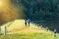 Man and woman couple walking at beautiful sunny morning at pang ung lake park in Thailand