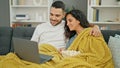 Man and woman couple watching movie on laptop at home Royalty Free Stock Photo