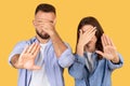 Man and woman covering eyes, showing stop hand gesture Royalty Free Stock Photo