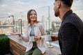 Man and woman coworkers having nice conversation at office balcony Royalty Free Stock Photo