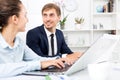 Man and woman coworkers working on computers Royalty Free Stock Photo