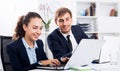 Man and woman coworkers working on computers Royalty Free Stock Photo