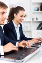 Man and woman coworkers working on computers Royalty Free Stock Photo