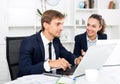 Man and woman coworkers working on computers Royalty Free Stock Photo