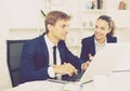 Man and woman coworkers working on computers Royalty Free Stock Photo