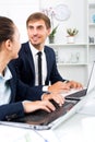 Man and woman coworkers working on computers Royalty Free Stock Photo