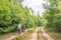 Man and woman cycling in a large nature reserve