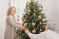 Man and woman decorating christmas tree Royalty Free Stock Photo