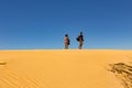 A man and a woman at the desert horizon Royalty Free Stock Photo