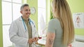 Man and woman dietician and patient speaking at the clinic