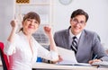 Man and woman discussing in office