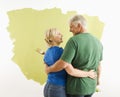 Man and woman discussing paint job. Royalty Free Stock Photo