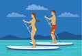 Man and woman do stand up paddling