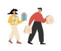 A man and woman doing Xmas shopping. Guy and girl holding gifts in their hands and walking. A couple buying presents on