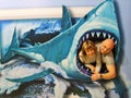 A man and a woman drawn in the jaws of a shark Royalty Free Stock Photo