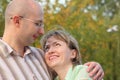 Man and woman in early fall park. Royalty Free Stock Photo