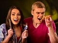 Man and woman eat slice pizza with knife and fork . Royalty Free Stock Photo