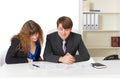 Man and woman - engineers, working in office Royalty Free Stock Photo