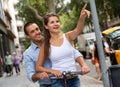 Man and woman enjoying electro scooter riding