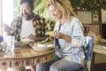 Man and woman enjoying lunch together sitting at the table in a cafe restaurant smiling and talking with happiness. Dating people Royalty Free Stock Photo