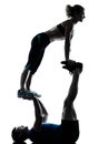 Man woman exercising acrobatic workout fitness silhouette Royalty Free Stock Photo