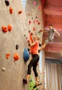 Man and woman exercising at indoor climbing gym Royalty Free Stock Photo