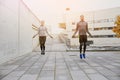 Man and woman exercising with jump-rope outdoors Royalty Free Stock Photo