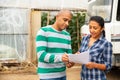 Man and woman farmers talking near car Royalty Free Stock Photo