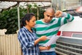 Man and woman farmers talking near car Royalty Free Stock Photo