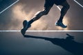 A close-up man or woman athlete feet running on Running track for workout in wellness concept at sunrise. Royalty Free Stock Photo