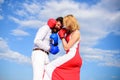 Man and woman fight boxing gloves sky background. Attack is best defence. Women can fight back concept. Defend your