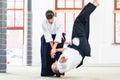 Man and woman fighting at Aikido martial arts school Royalty Free Stock Photo