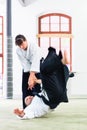 Man and woman fighting at Aikido martial arts school Royalty Free Stock Photo