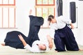 Man and woman fighting at Aikido martial arts school Royalty Free Stock Photo