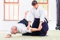 Man and woman fighting at Aikido martial arts school Royalty Free Stock Photo