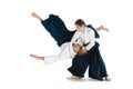 Man and woman fighting at Aikido training in martial arts school Royalty Free Stock Photo