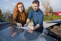 Man and woman filling an insurance car report after car crash Royalty Free Stock Photo
