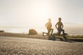 Man, woman or fitness stretching at sunset for exercise, training or workout for heart health, cardio or muscle growth Royalty Free Stock Photo